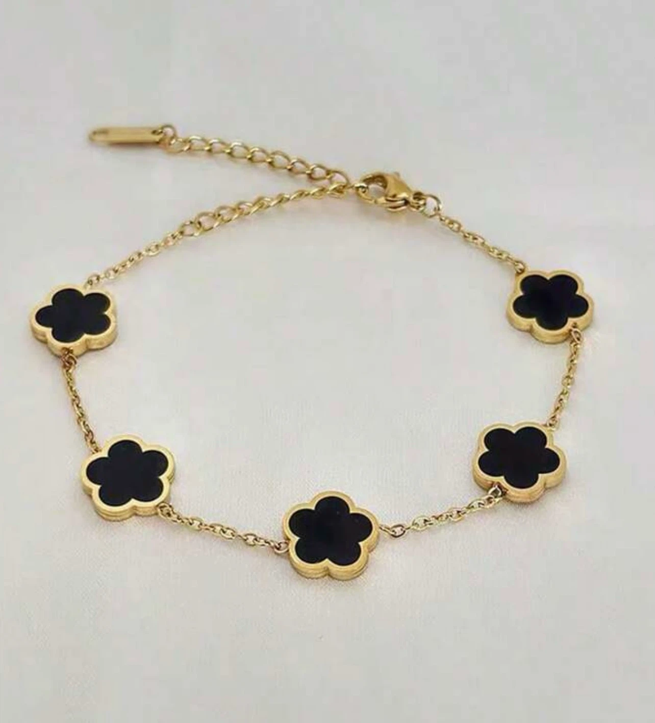 Gold Tone Flower Bracelet with Black Charms