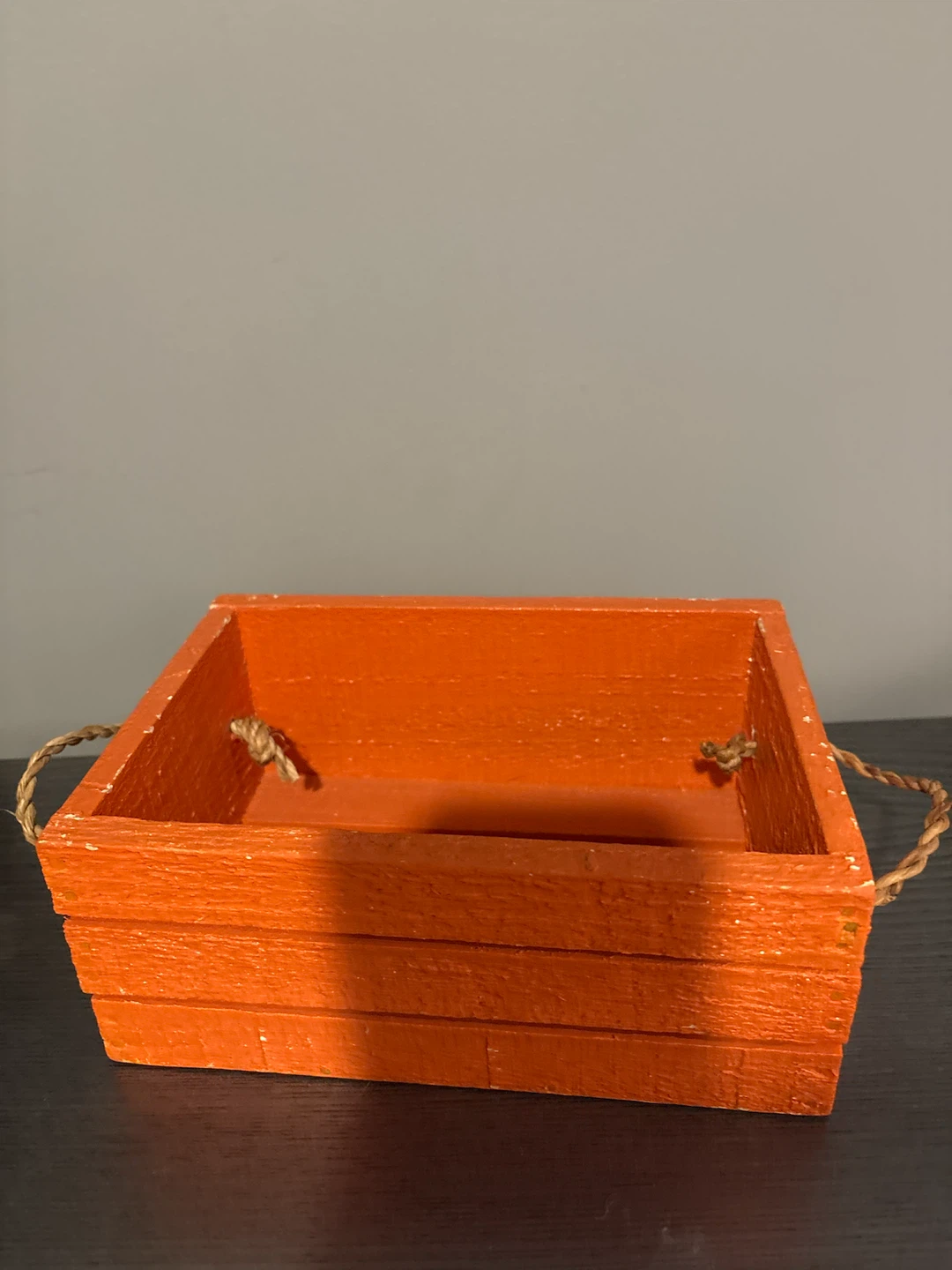 Orange wooden storage crate