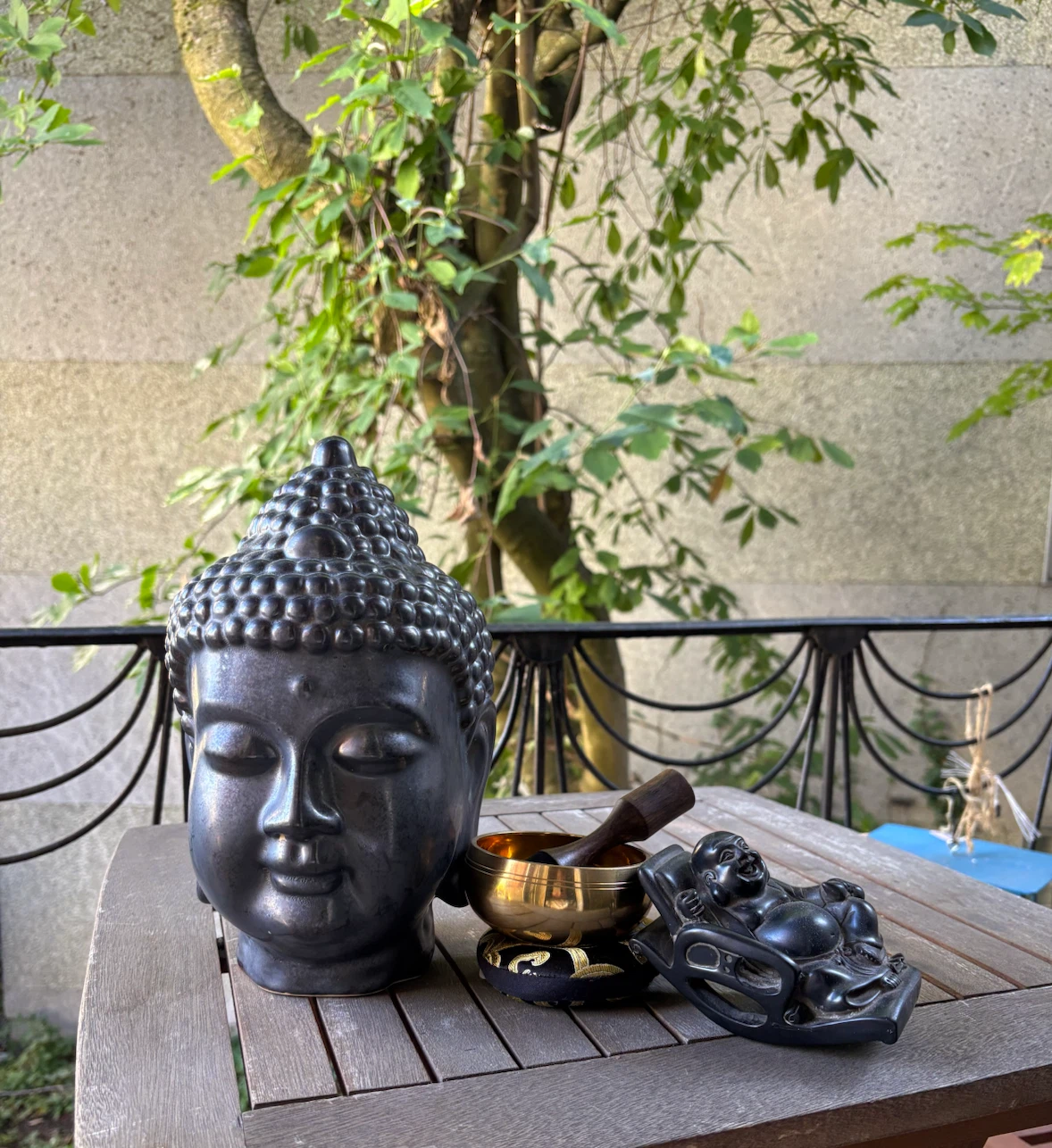 Decorative Buddha Head, Singing Bowl, and Figurine Set