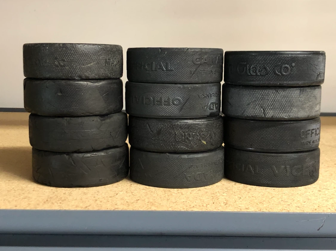 12 Hockey Pucks that have seen things