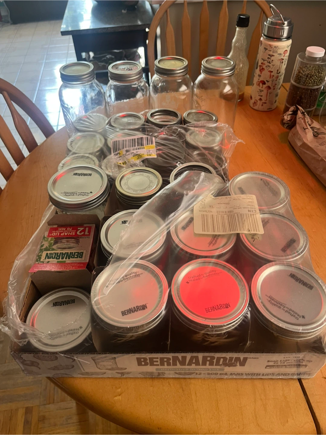 Assorted new and used clean canning jars