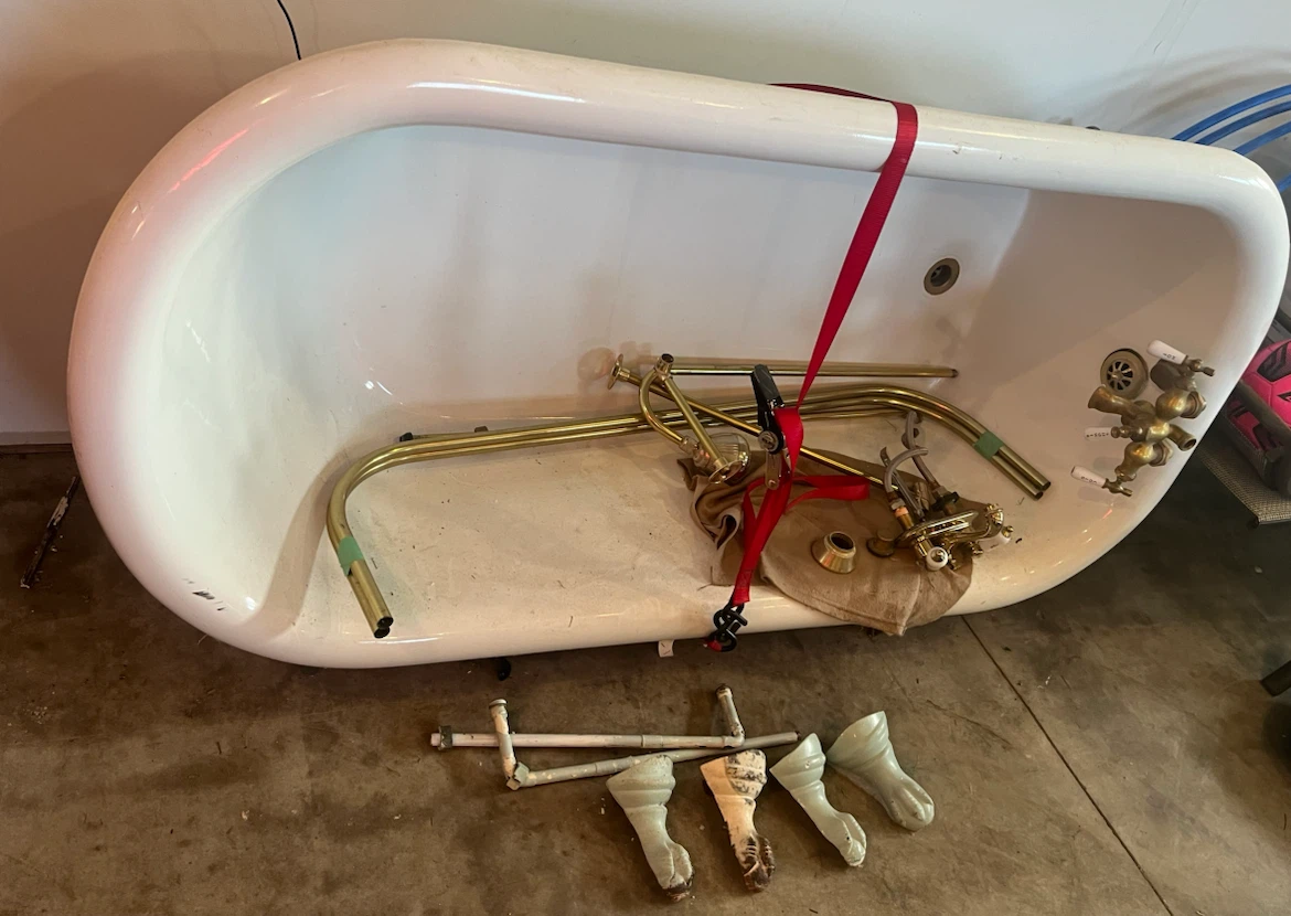 Vintage Cast Iron Tub with Plumbing Attachments