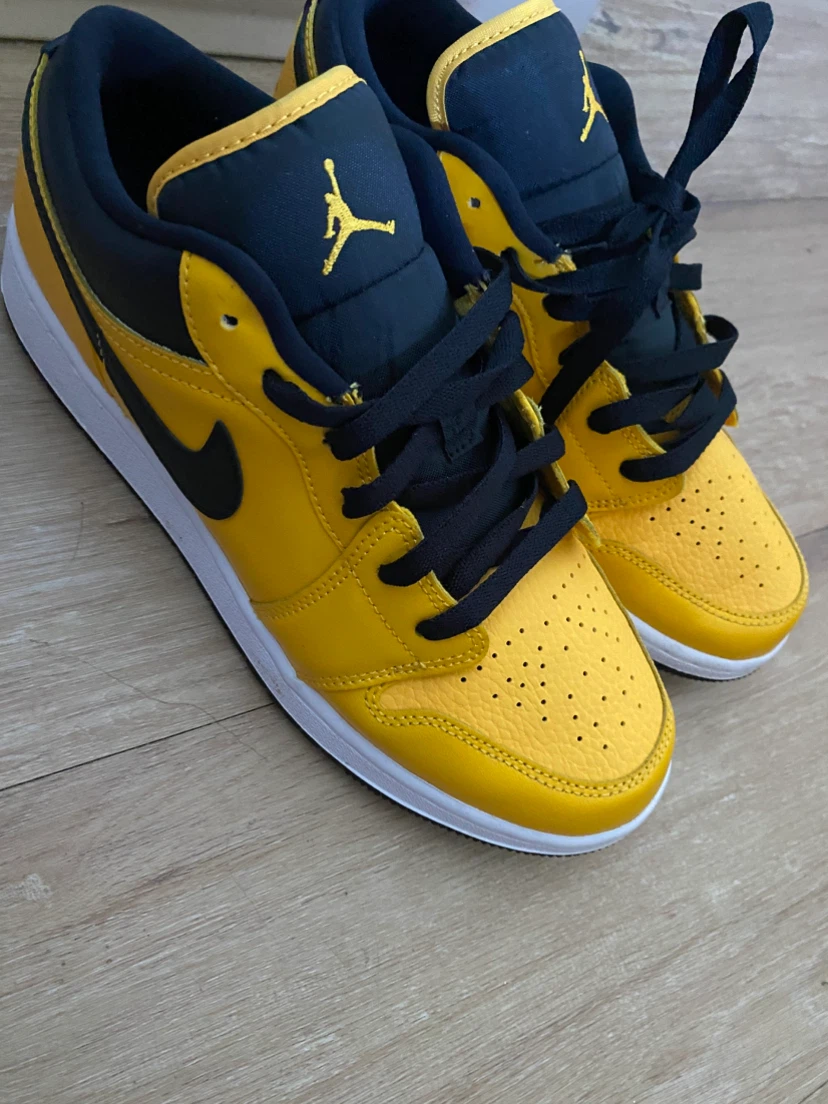 Jordan 1 Low Pollen Yellow and Black Sneakers