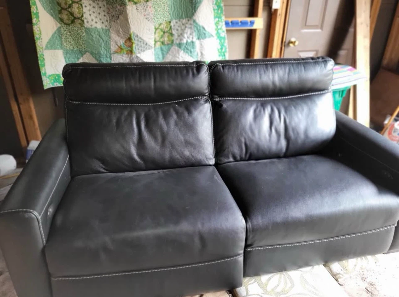 Black leather power reclining loveseat
