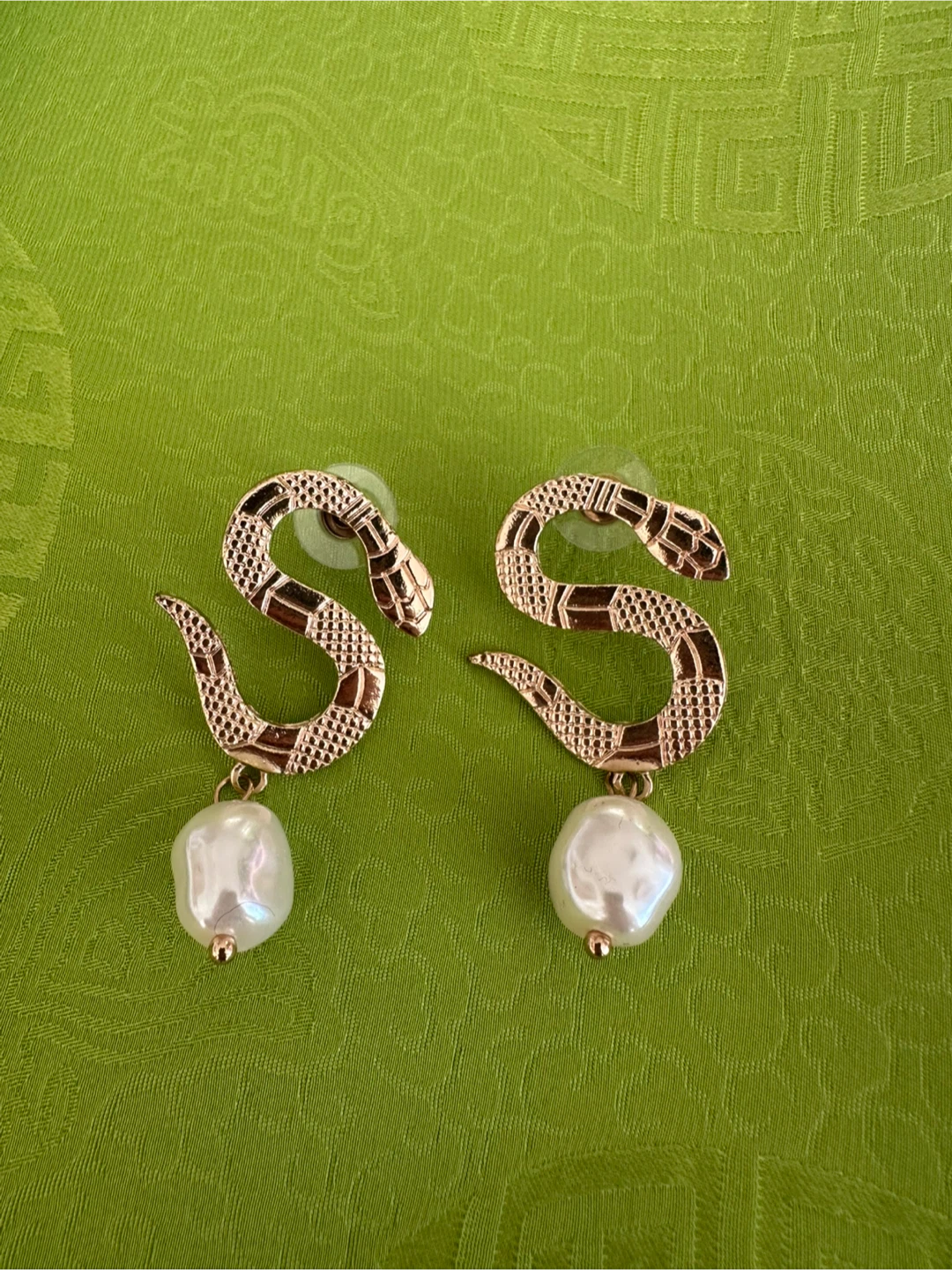 Gold-toned snake earrings with pearl drops