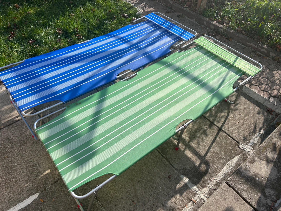 Two folding camp bed cots