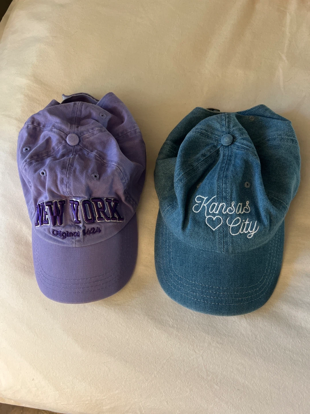 Two embroidered baseball caps