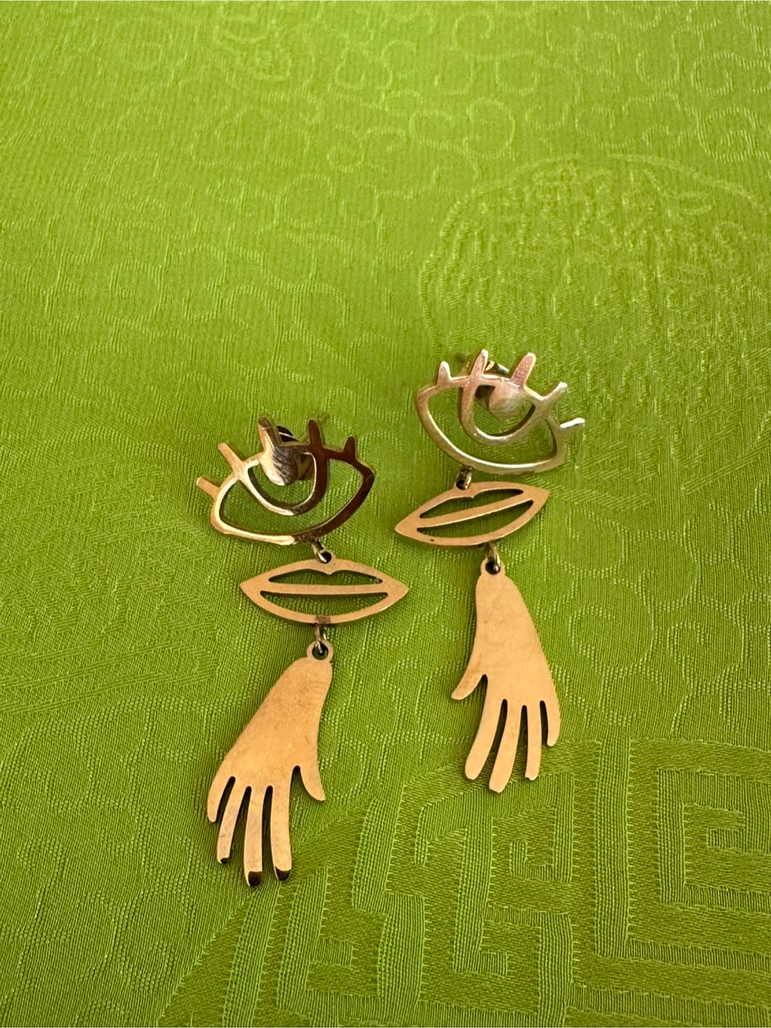 Gold-Tone Abstract Eye, Lip, and Hand Earrings
