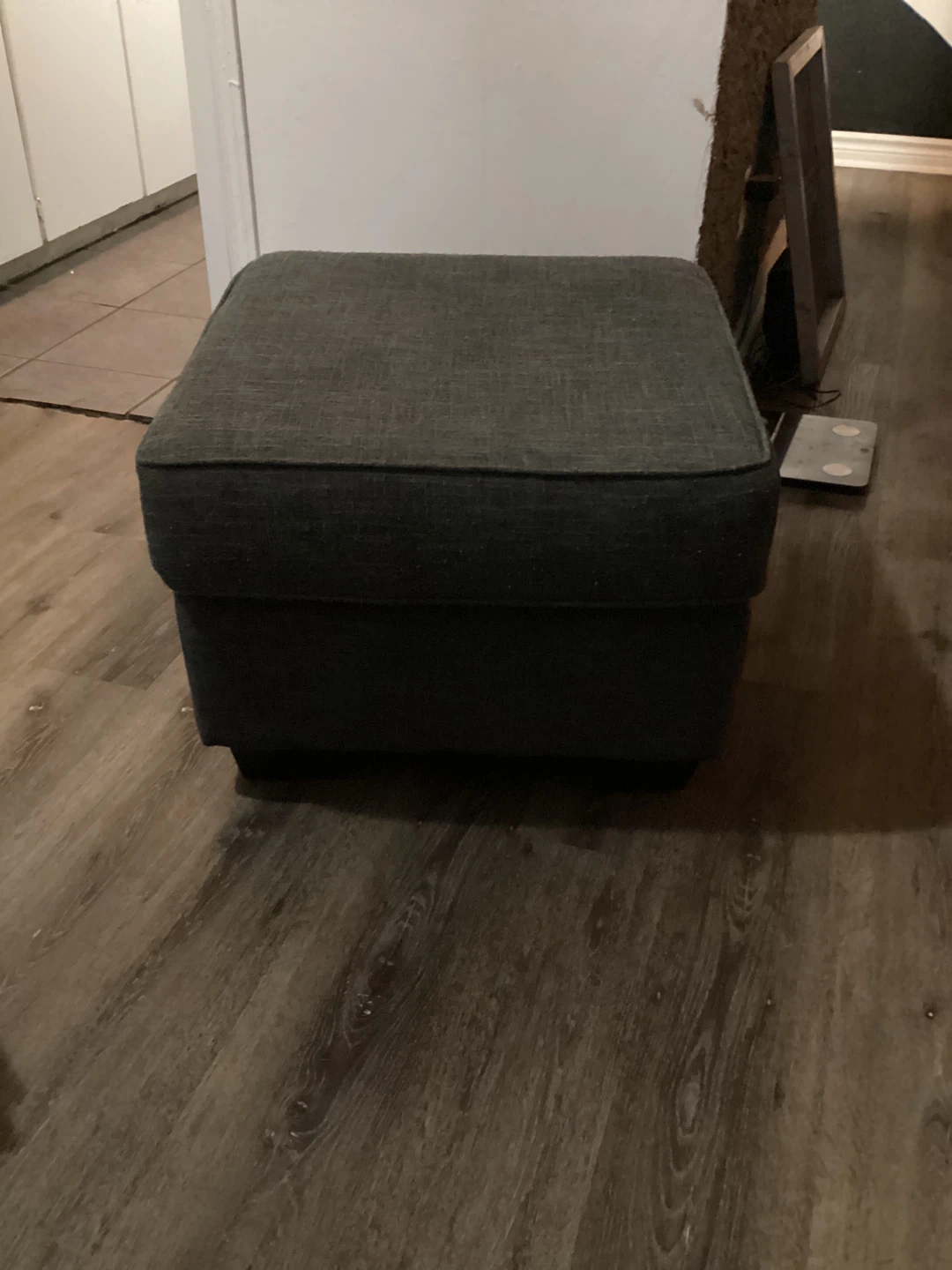 Dark grey fabric ottoman footstool