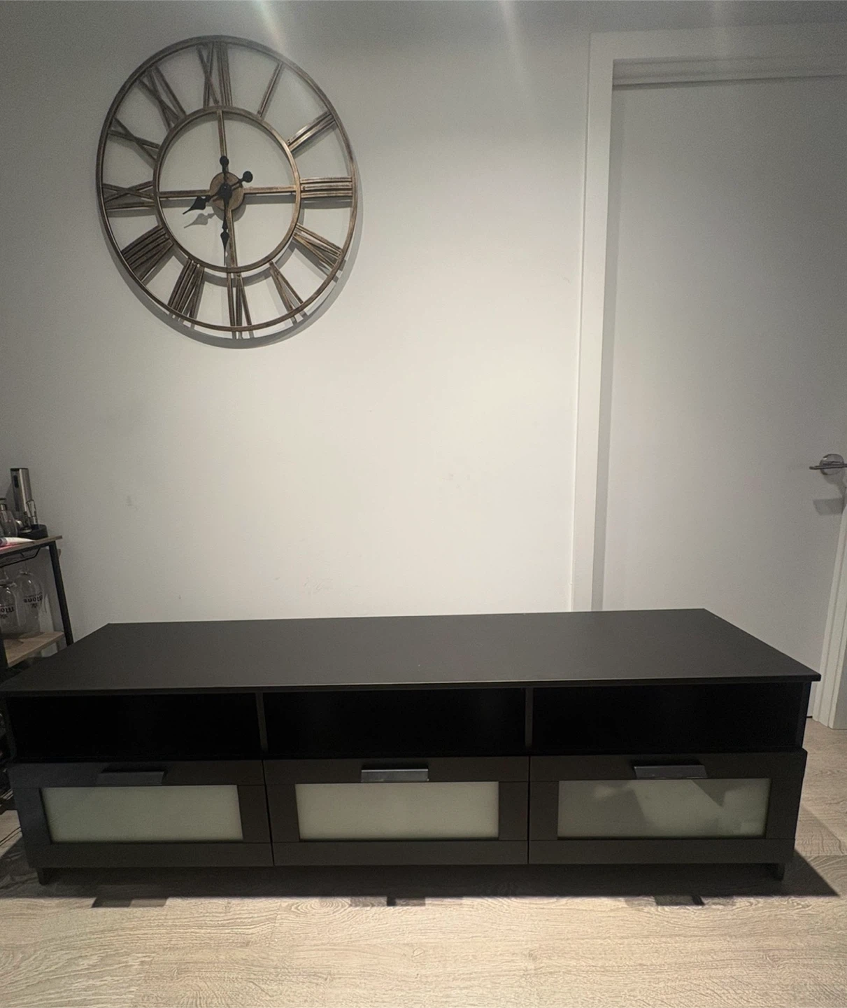 Black TV media unit with frosted glass drawers