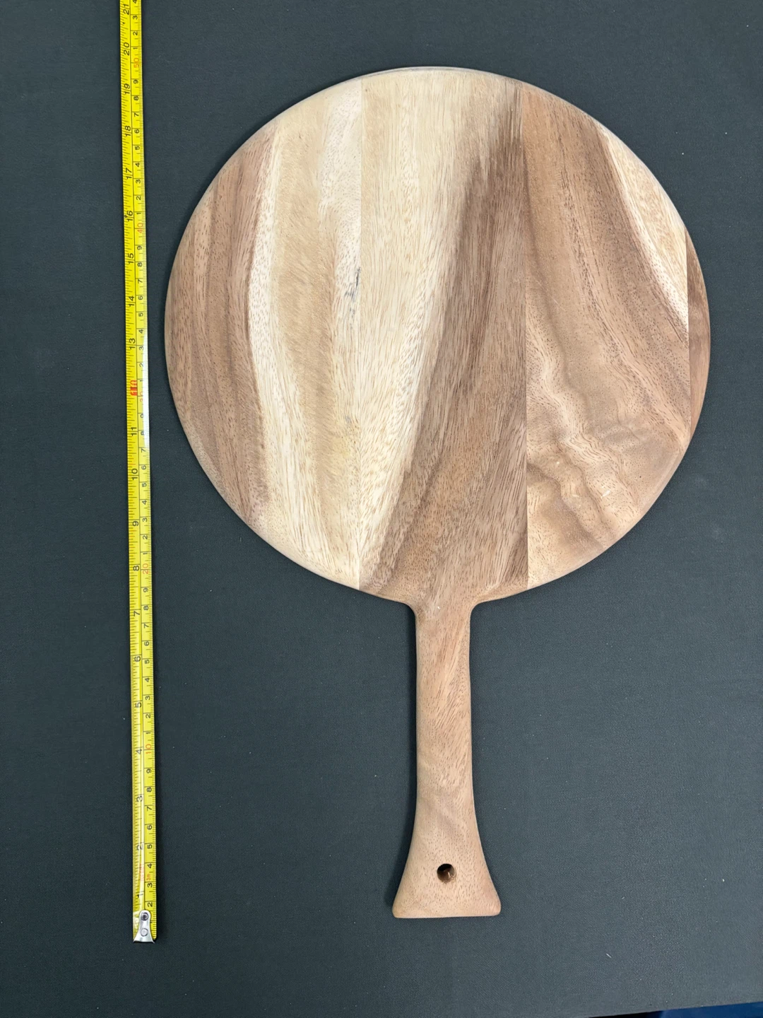 Round wooden serving board with handle