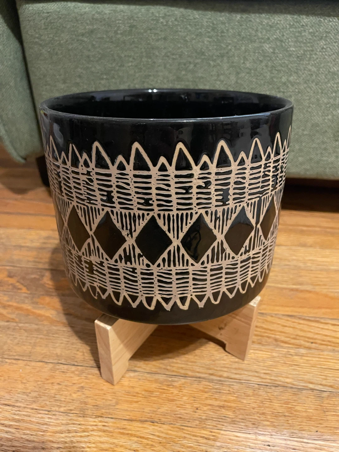 Dark blue patterned ceramic planter with wooden stand