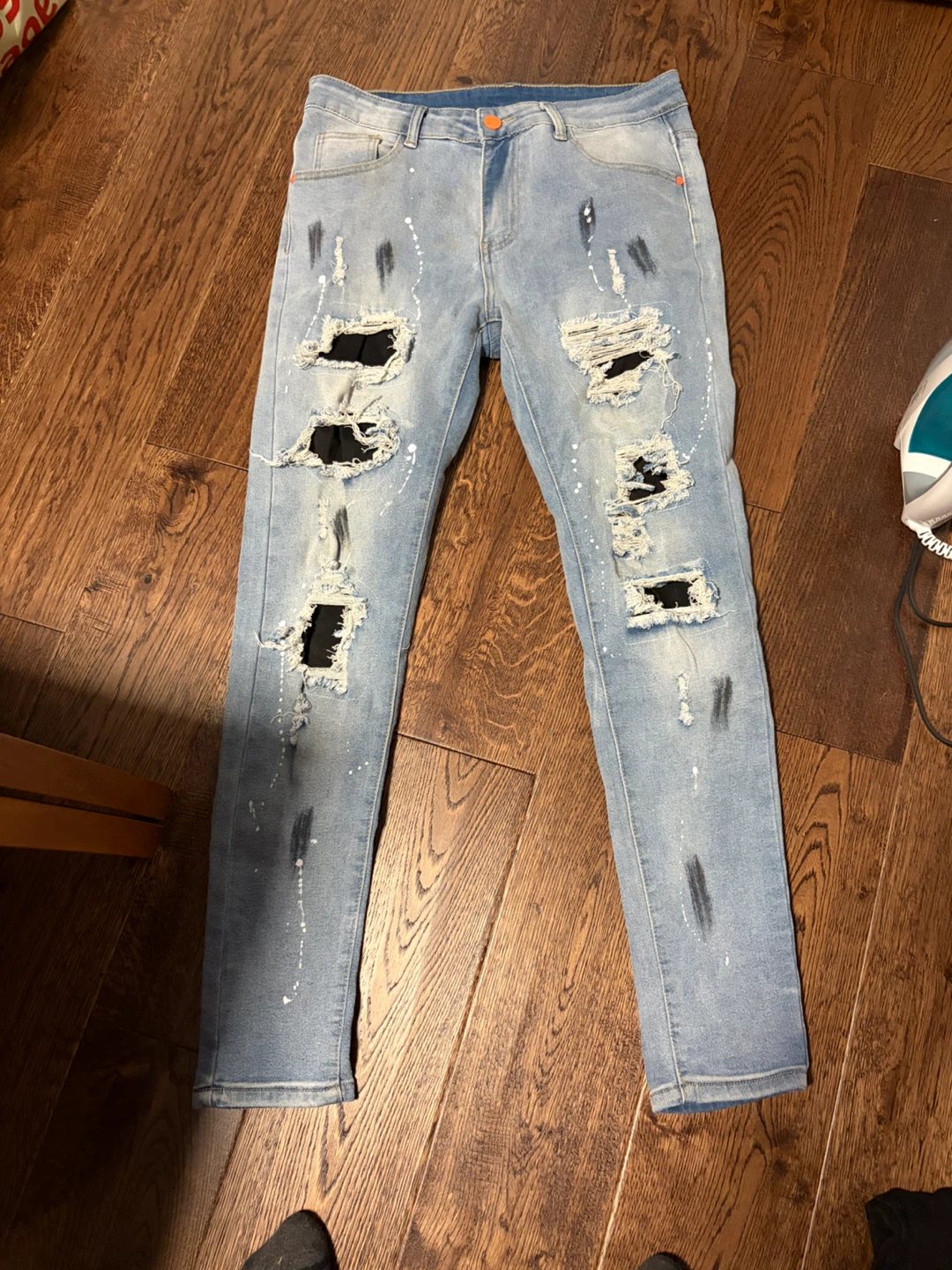 Light wash distressed denim jeans