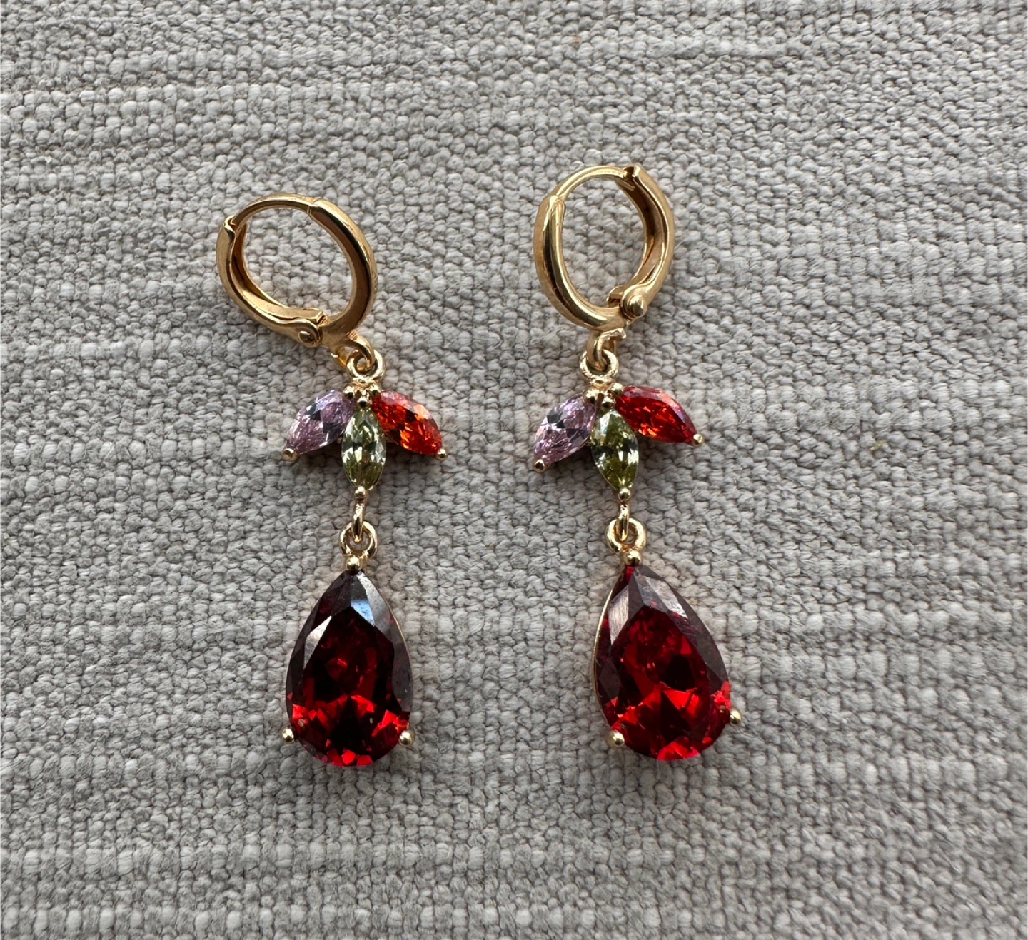 Gold-toned drop earrings with red stones