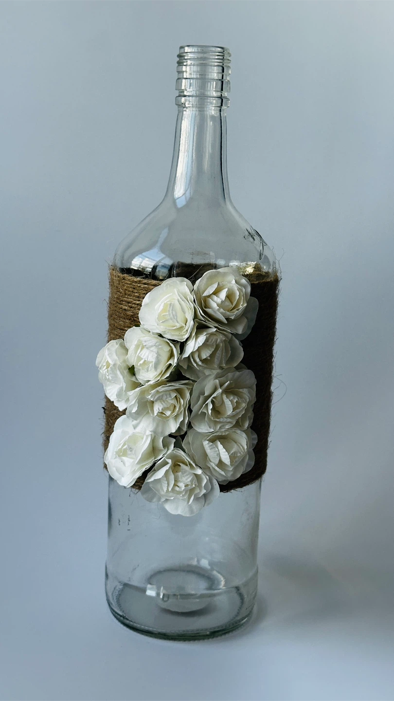 Decorative Glass Bottle with Jute and Floral Accents
