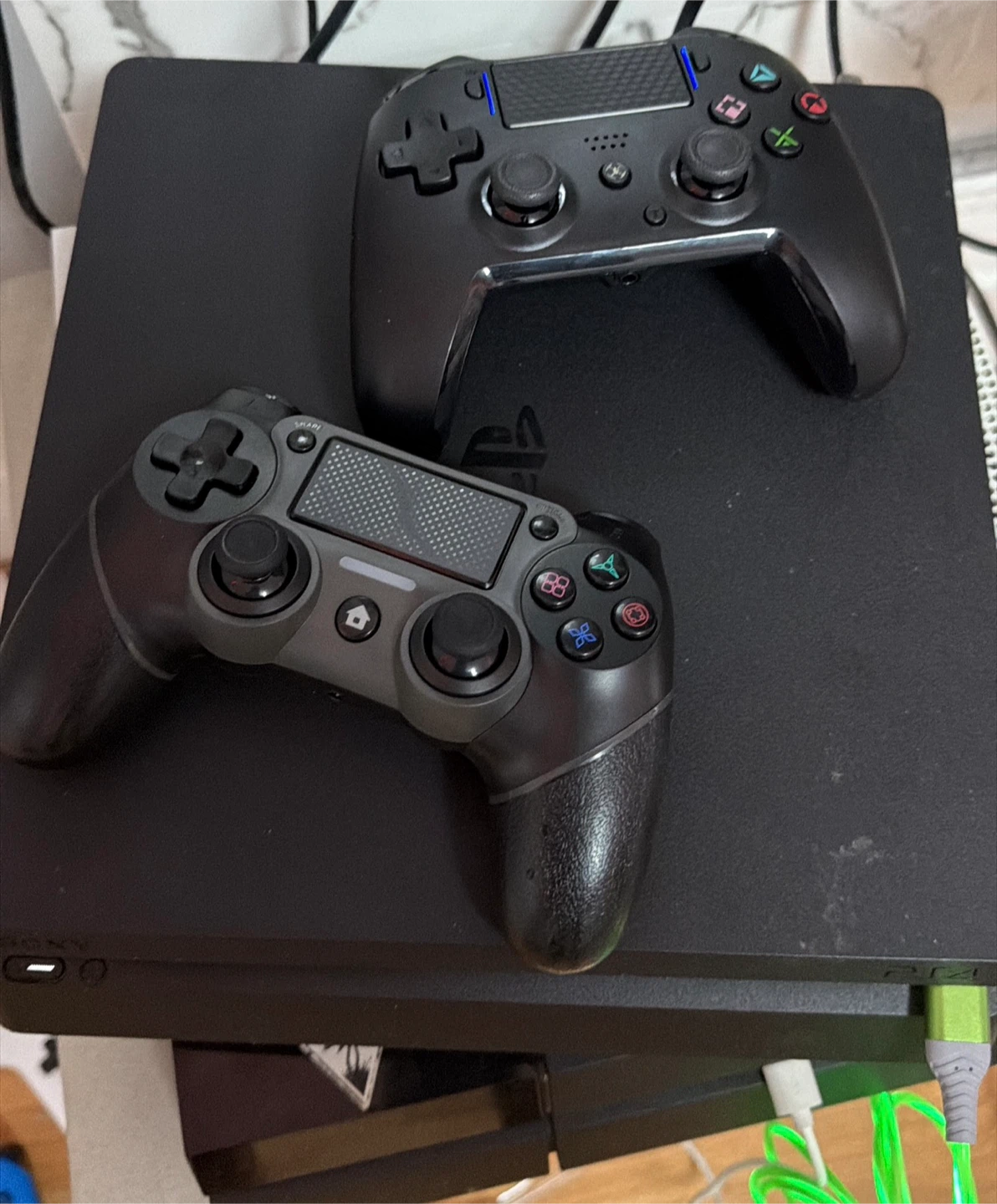 Sony PlayStation 4 Slim Console with Two Controllers