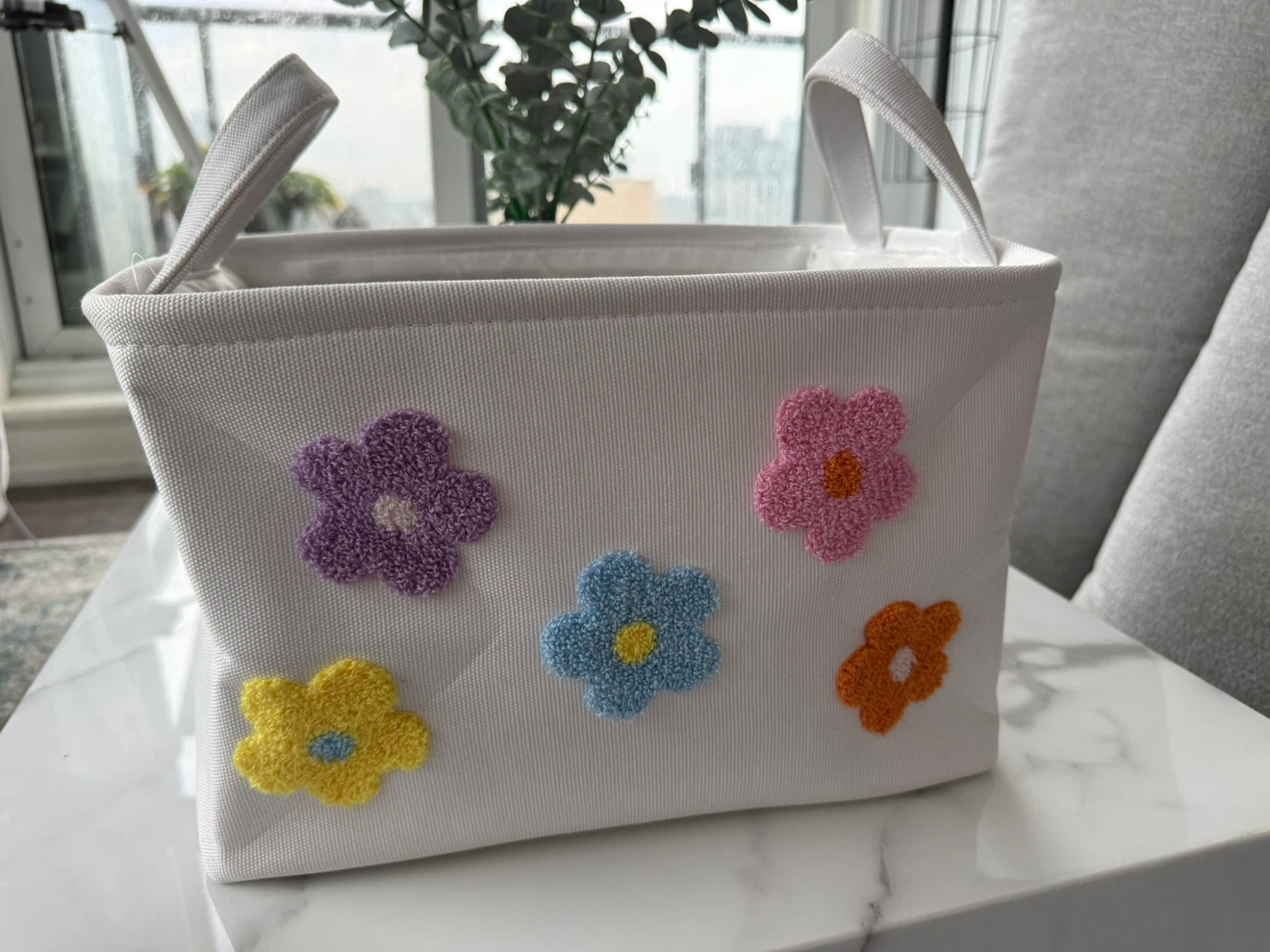 White storage basket with floral applique