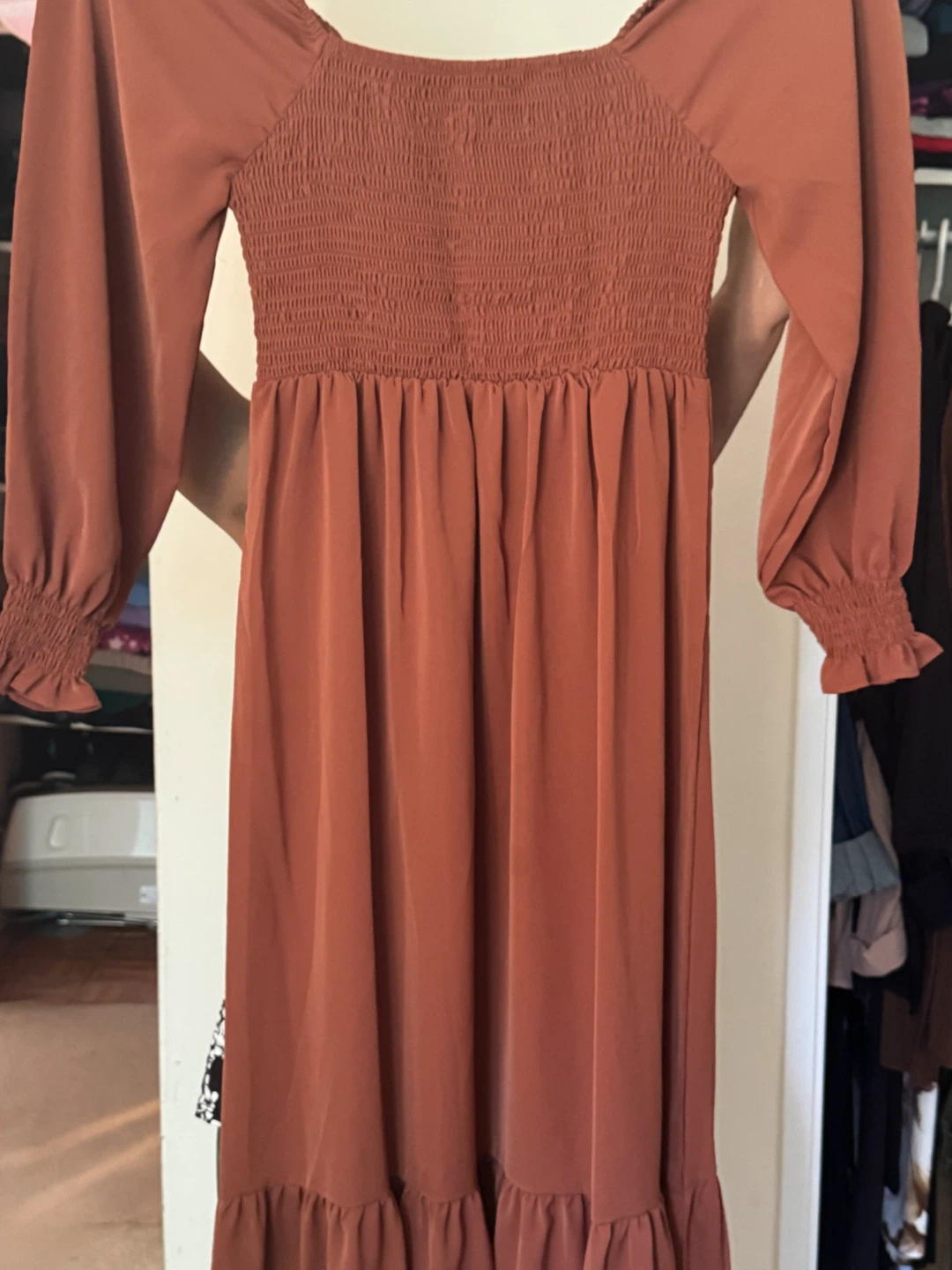 Rust-colored long sleeve midi dress