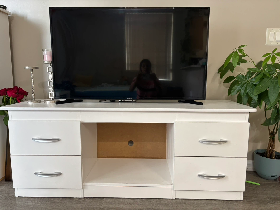 White TV stand with four storage drawers