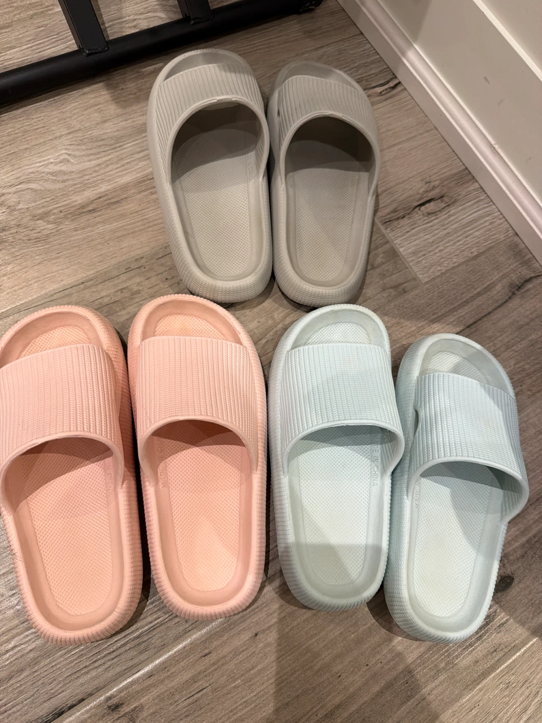 Three pairs of unisex slide sandals