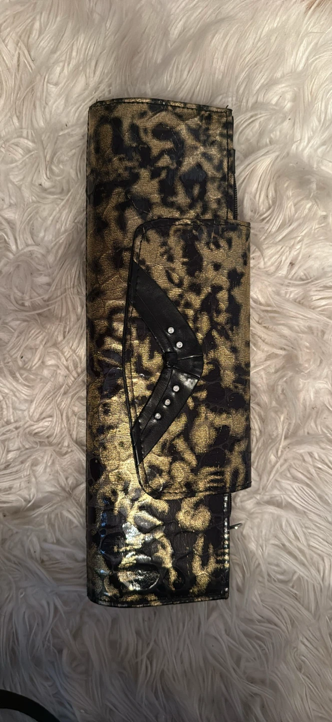 Gold and black animal print clutch