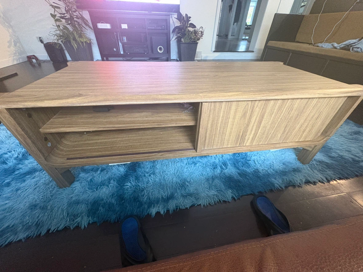 Modern rectangular coffee table, laminated hardboard finish.