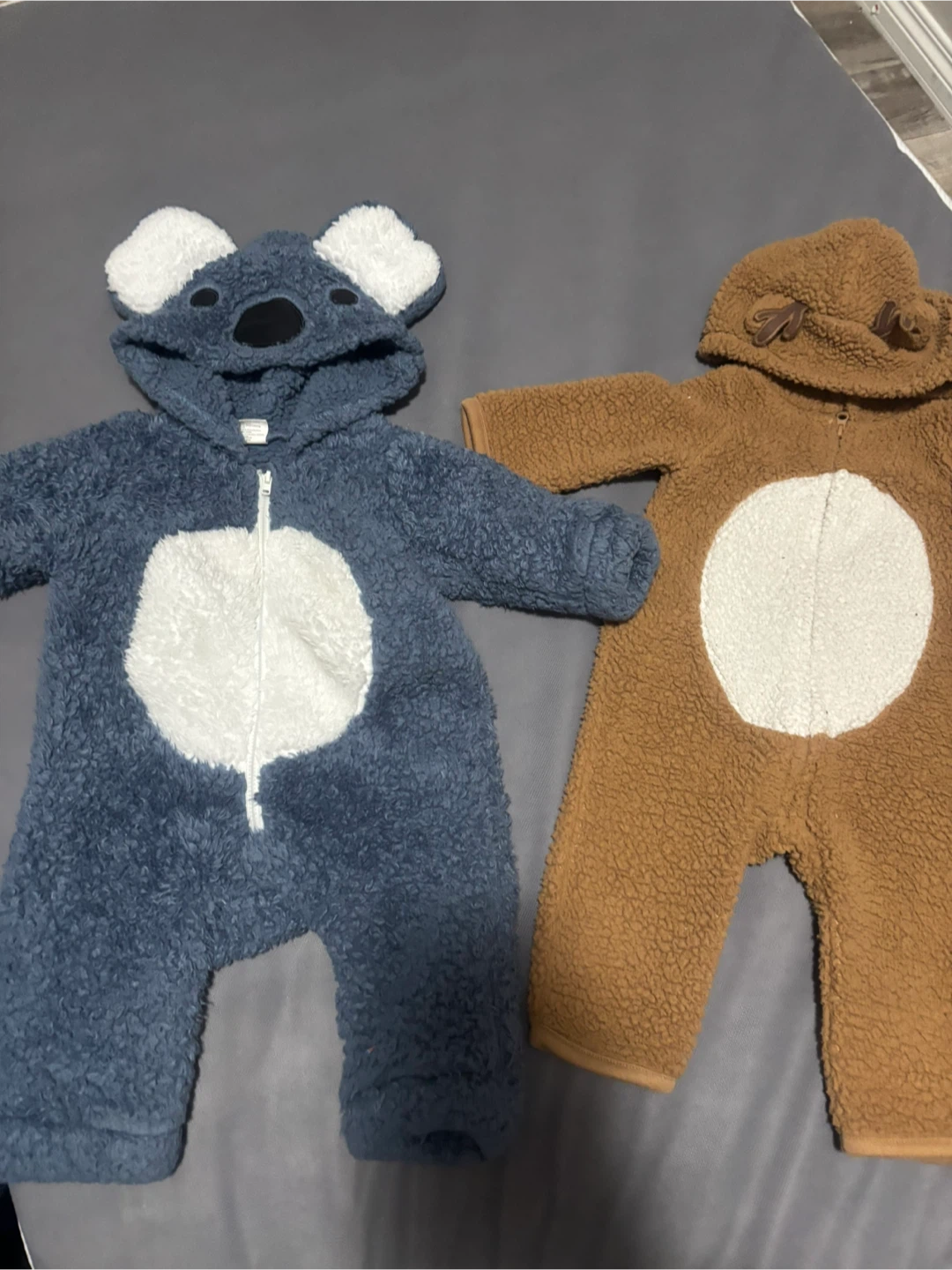 Two baby animal fleece rompers