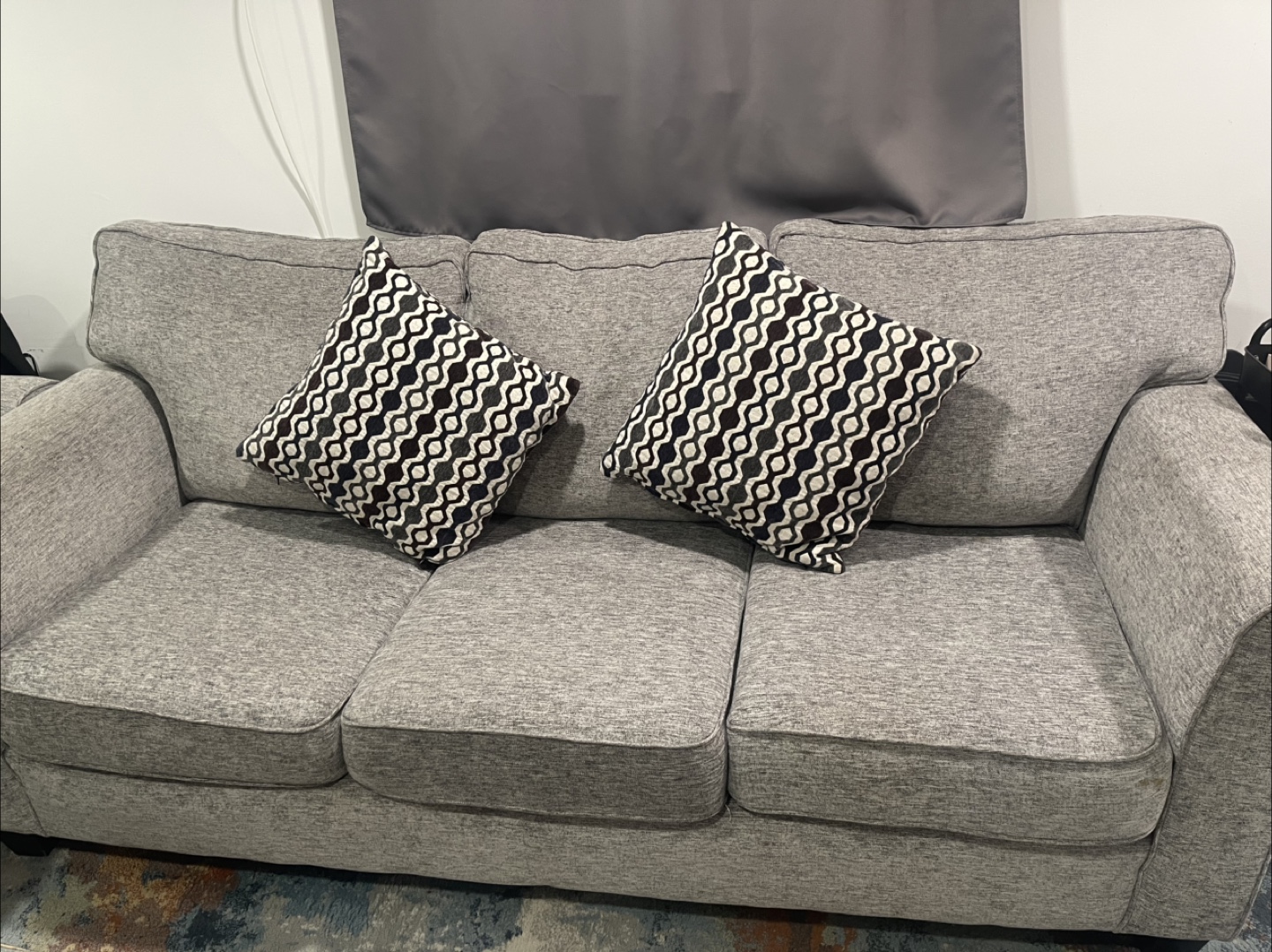 Grey Three-Seater Sofa with Patterned Cushions