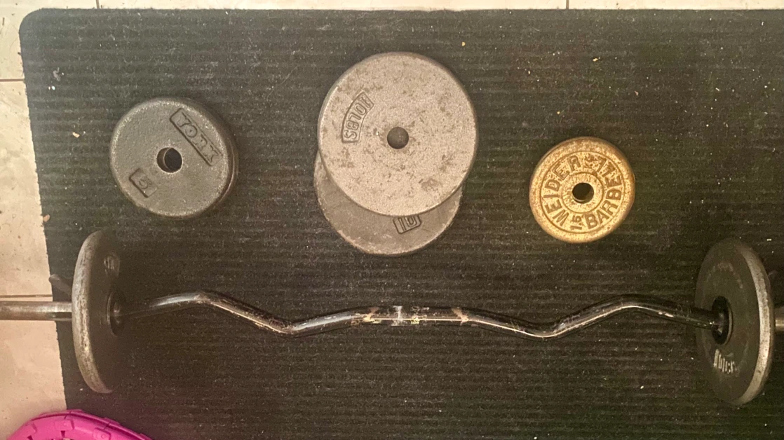 Selling my curl bar with 50lbs of weights