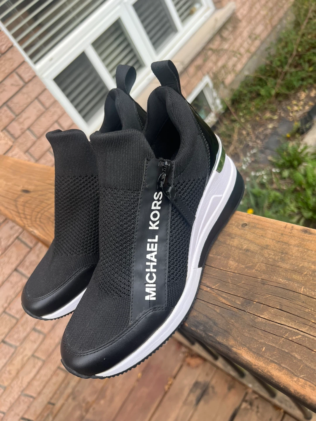 Woman’s Michael Kors Black wedge Sneakers size 8
