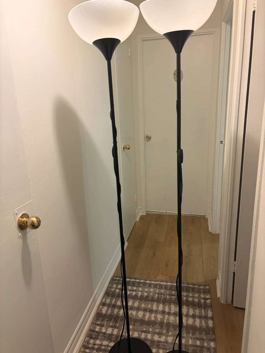 Two Black Torchiere Floor Lamps  Each 25$