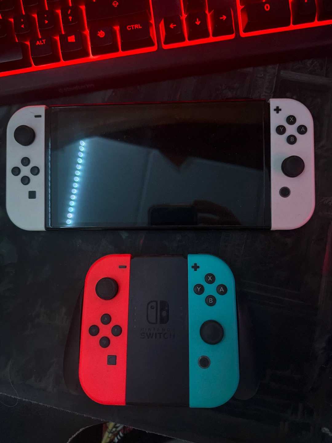Nintendo Switch OLED Model with 4 Games