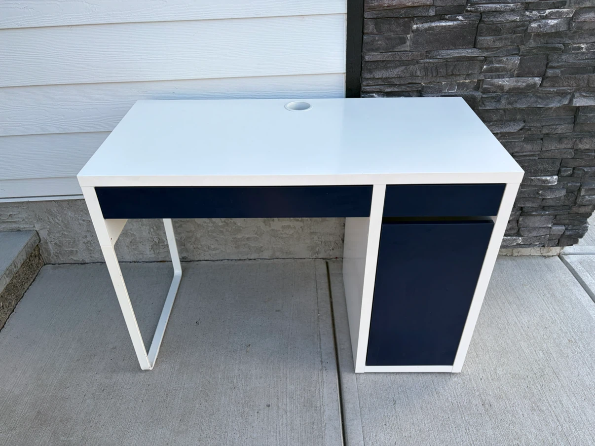 IKEA desk with blue drawers and doors
