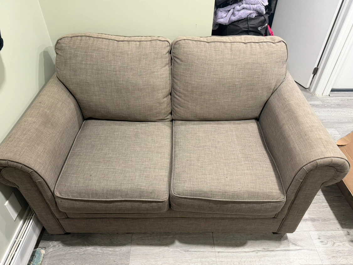 Beige two-seater loveseat sofa