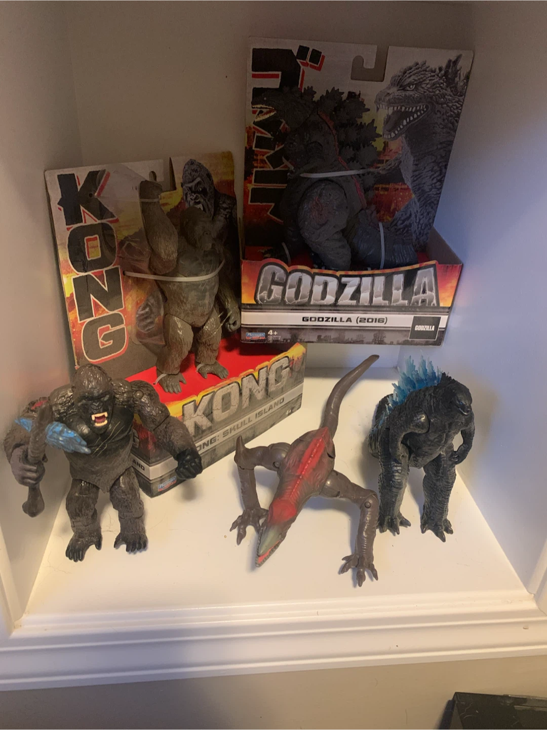 Assorted Action Figures Including Godzilla and WWE