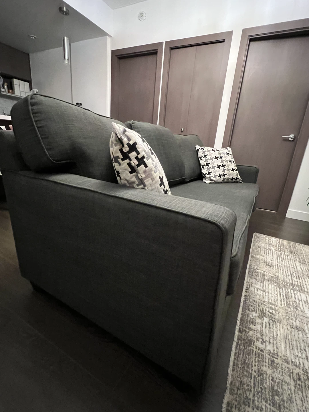 Dark grey fabric three-seater sofa