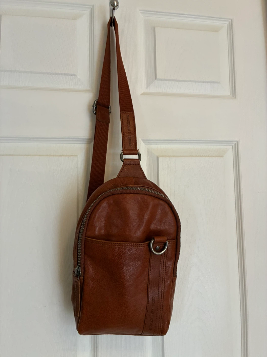 Unisex Spikes & Sparrow leather sling bag