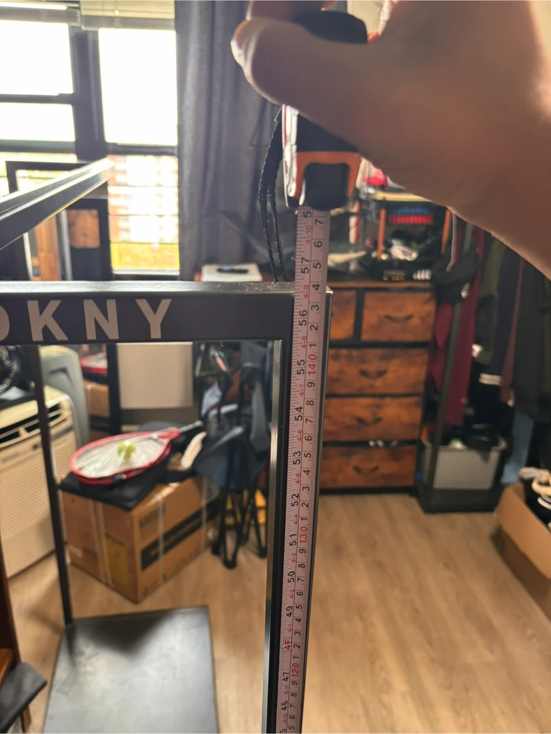 DKNY Industrial metal clothes rack with base
