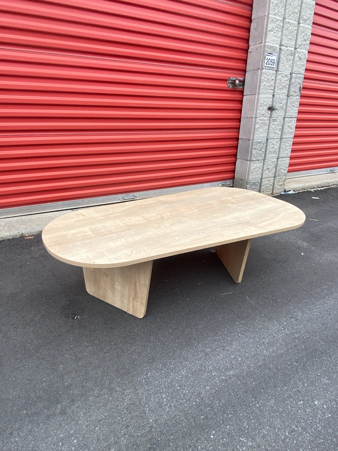 Oval light wood coffee table