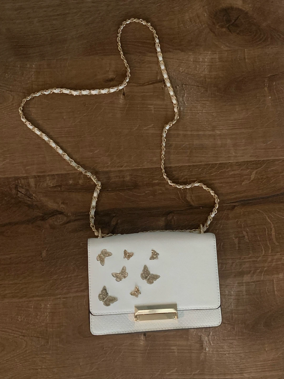 White ALDO handbag with gold butterflies