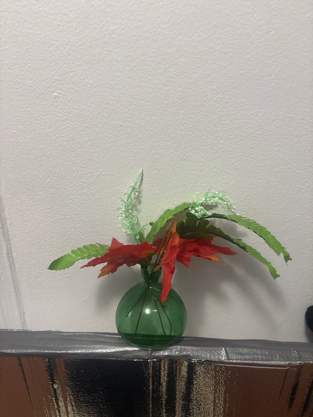Green Glass Vase with Artificial Flowers