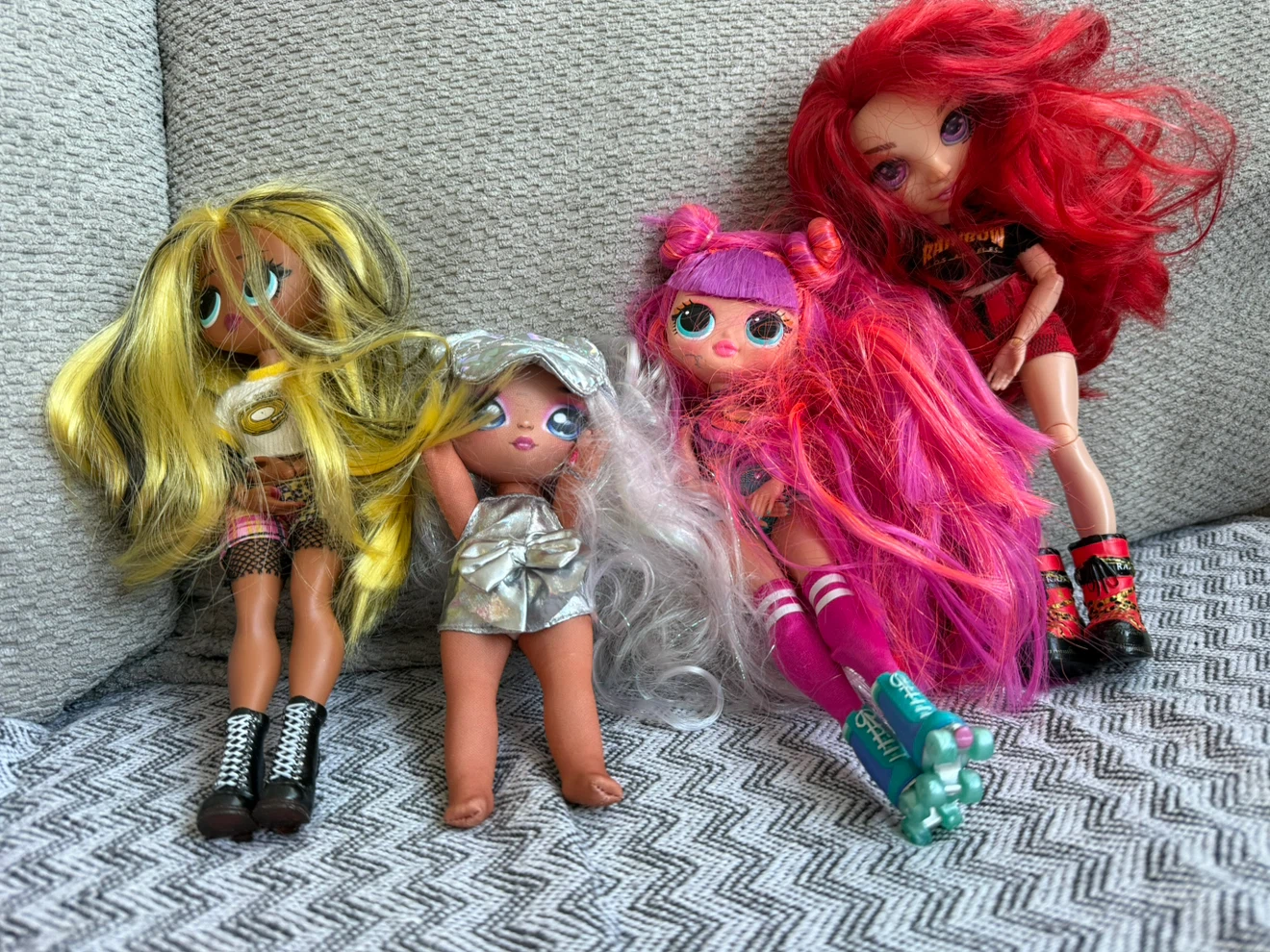 Assorted Dolls and Pink Toy Jeep
