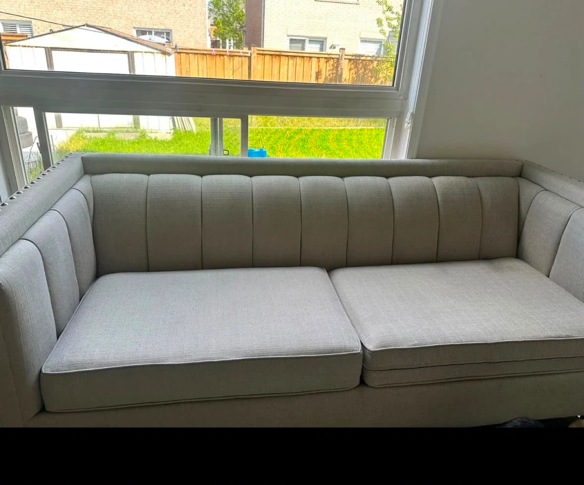 Beige Tufted Sofa and Patterned Accent Chair