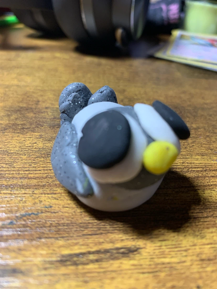 Handmade clay pigeon figurine