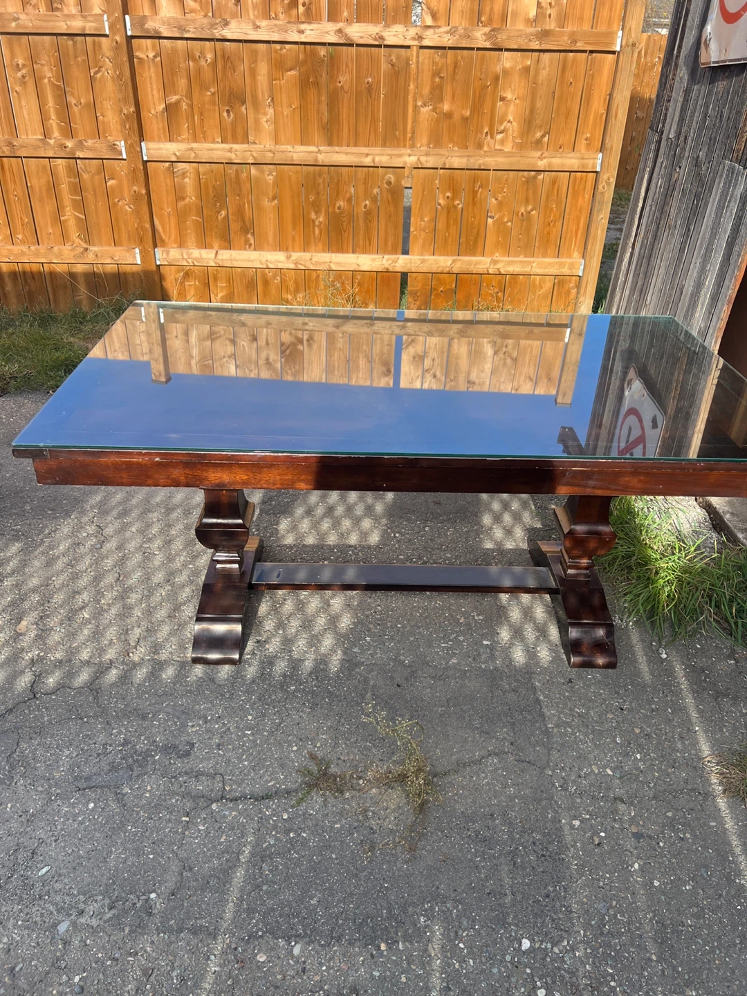 Elegant Dark Wood Dining Table with Glass Top