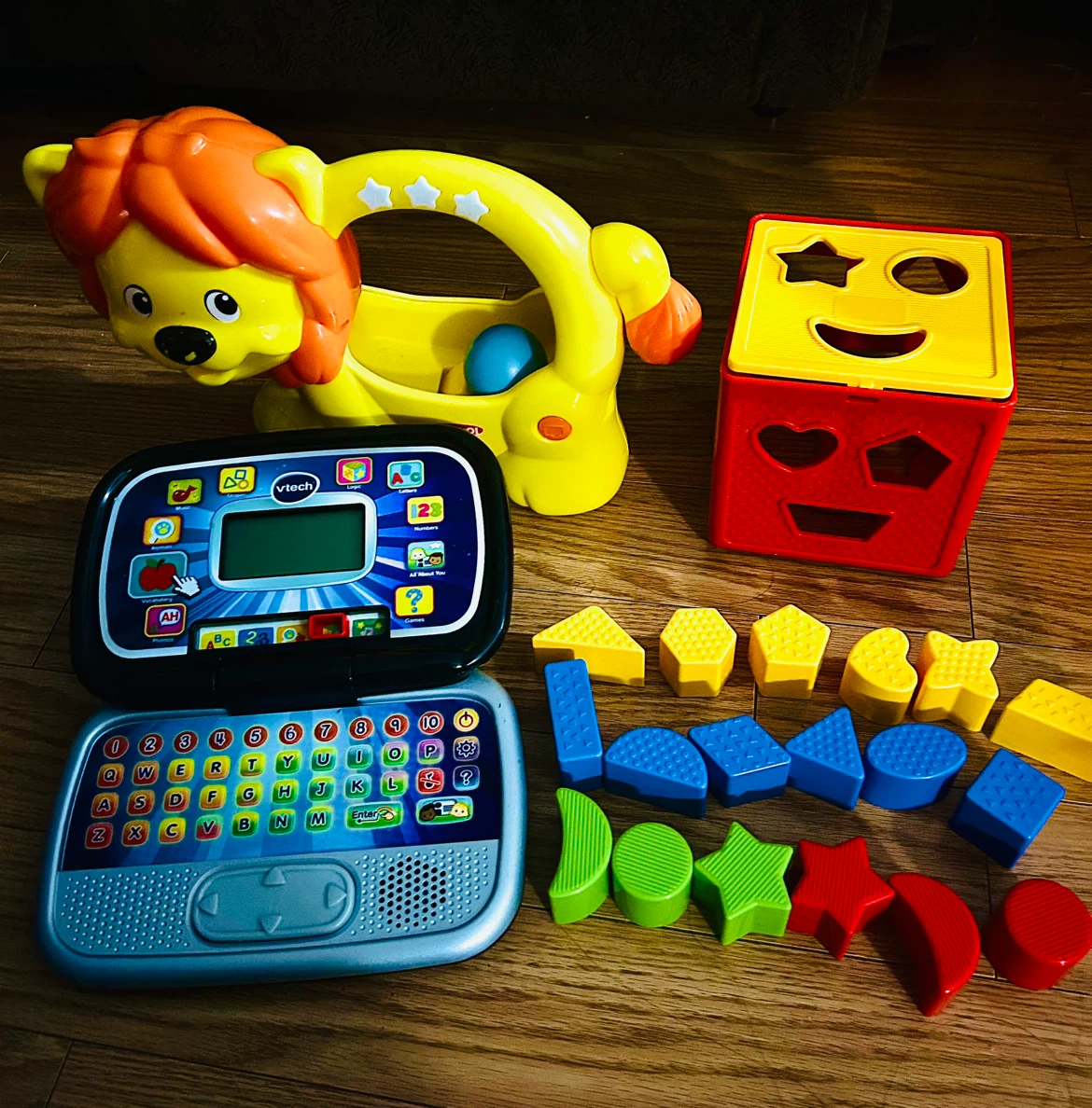VTech Laptop, Playskool Lion Toy, and Shape Sorter Set