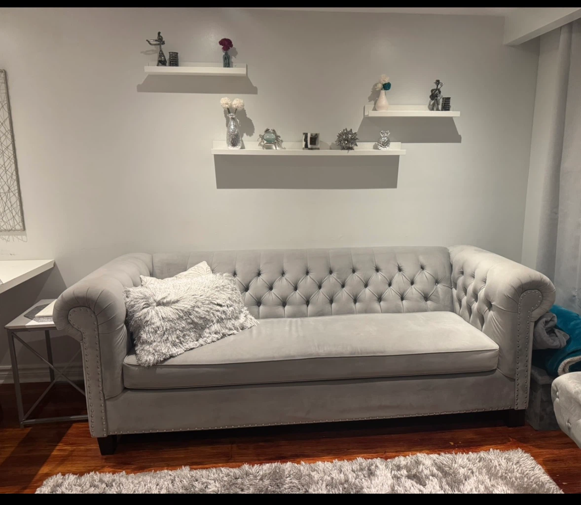 Grey Velvet tufted chesterfield sofa.