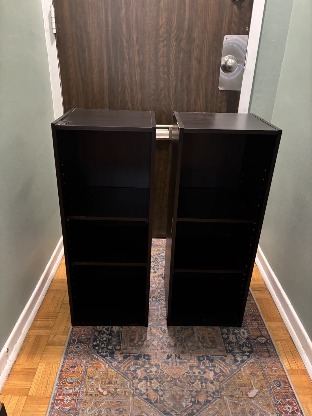 Two Black Wooden Shelving Units