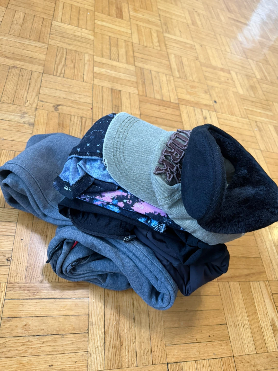 Assorted clothing and New York cap