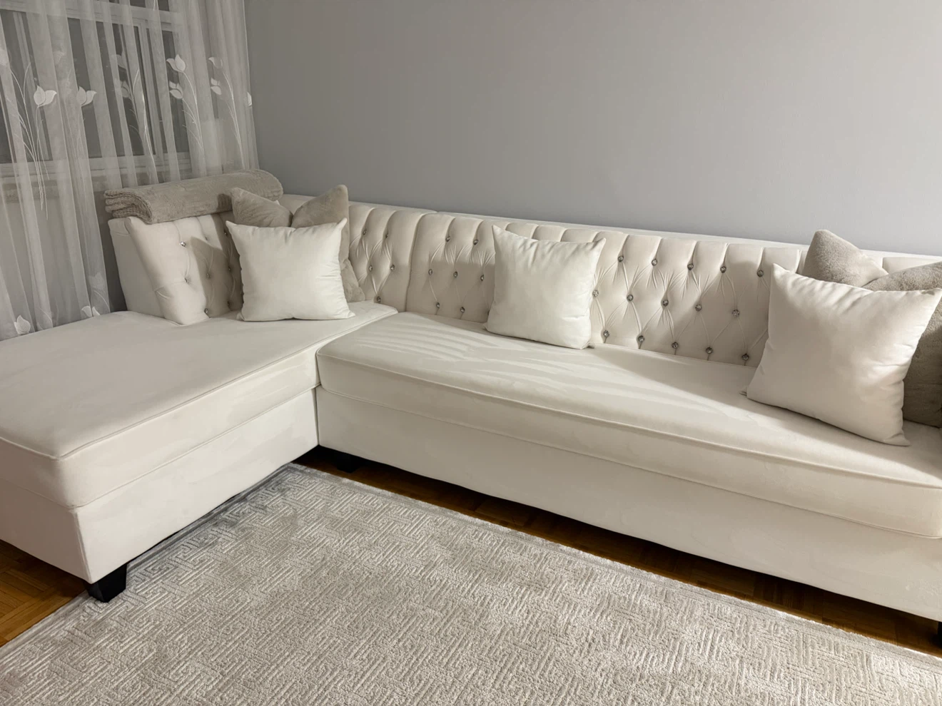 White tufted sectional sofa